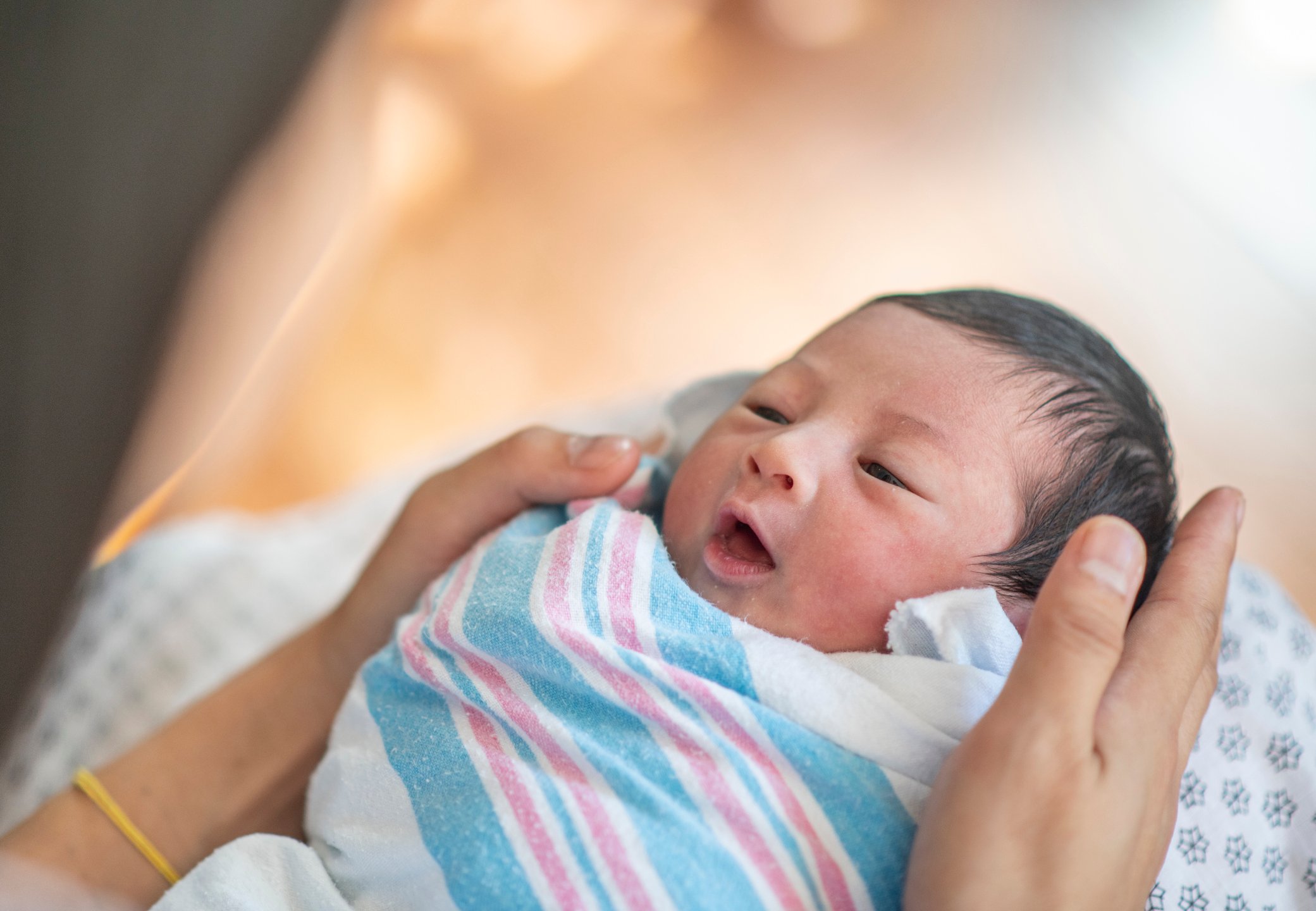 Swaddled Newborn Baby and Mother stock photo Swaddled Newborn Baby and Mother stock photo